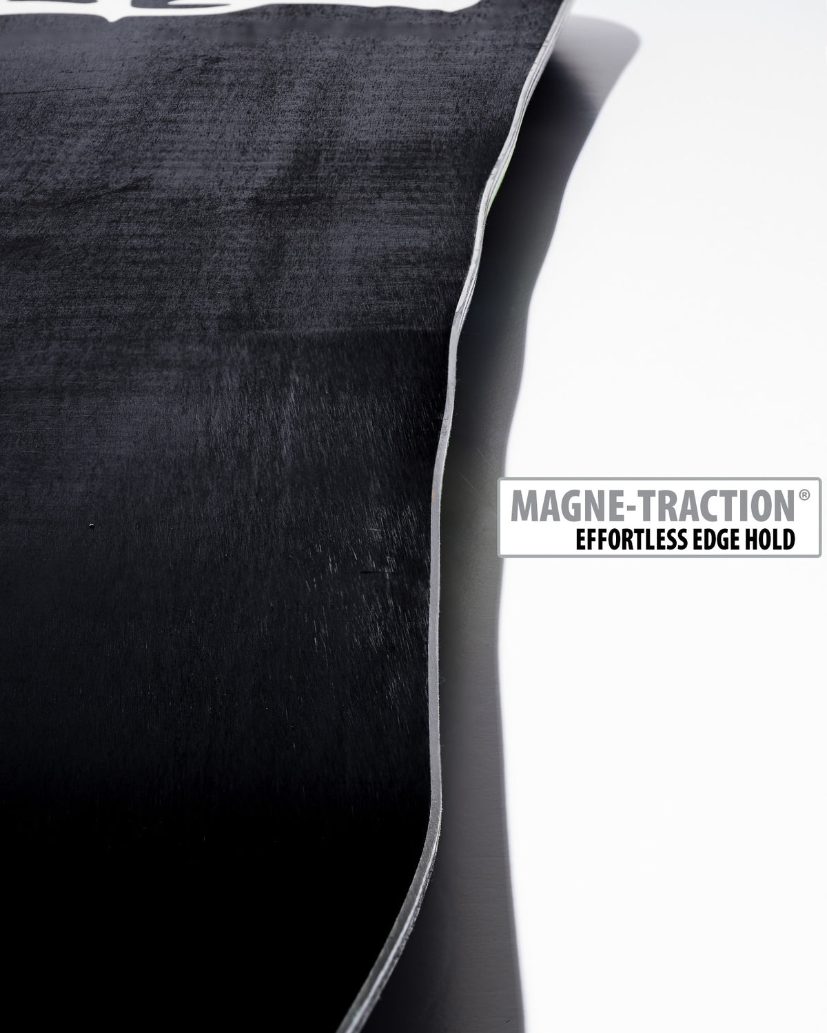 Lib Tech Skunk Ape Twin snowboard base close-up showing Magne-Traction serrated edge technology